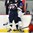 GRAND FORKS, NORTH DAKOTA - APRIL 16: Slovakia's Filip Krivosik #22 makes contact with Finland's Emil Oksanen #23 during preliminary round action at the 2016 IIHF Ice Hockey U18 World Championship. (Photo by Matt Zambonin/HHOF-IIHF Images)

